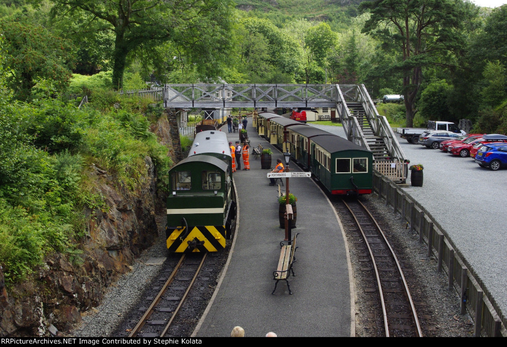 WORK TRAIN AND PASSENGER TRAIN AT STATION